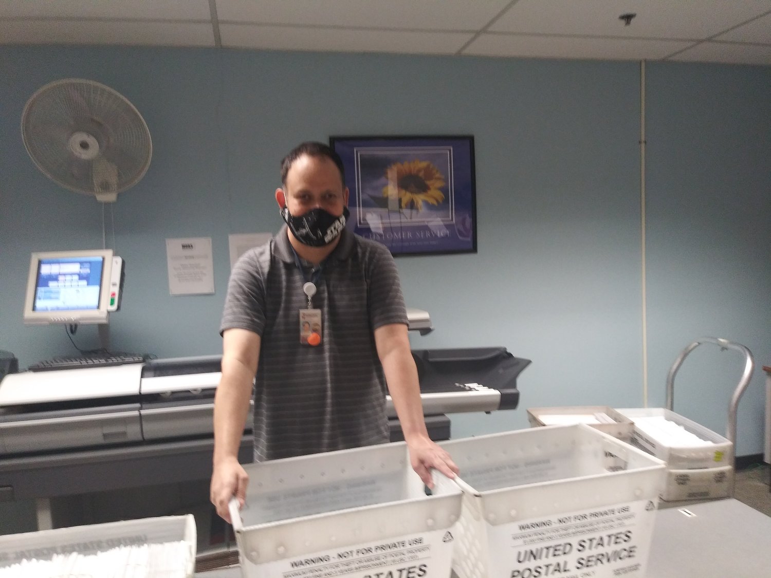 David Sandidge masks up while on the job in the DDS mailroom at MDRS.