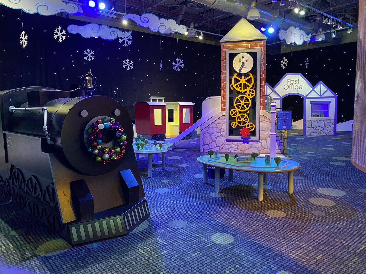 The train and clock tower add to the fun of the North Pole exhibit.