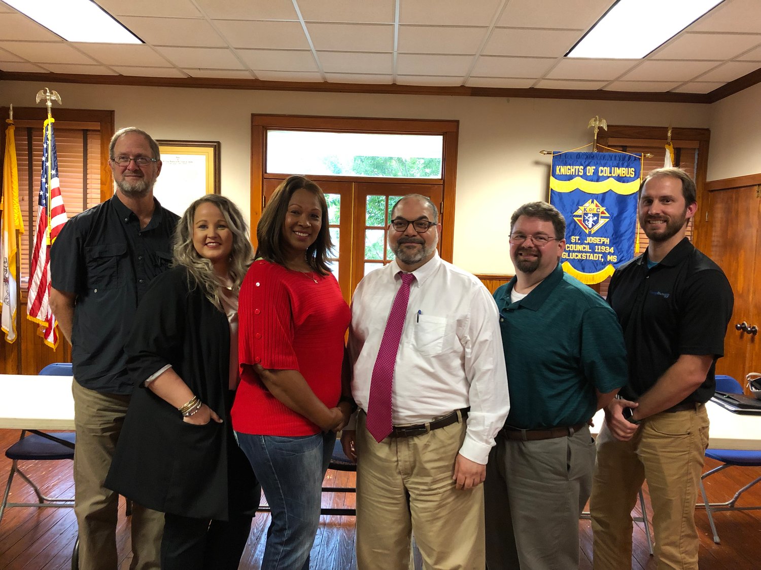 Newly-appointed Gluckstadt Planning and Zoning Commission Board members stand together after the conclusion of the special Gluckstadt meeting on July 19. Pictured, from left: Tim Slattery, Melanie Greer, Katrina Myrick, David Boackle, Lee Drake, and Andrew Duggar. Not pictured is Sam McGaugh.