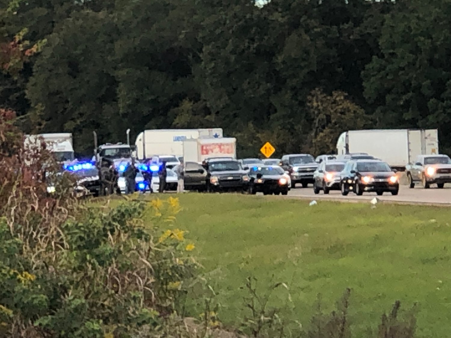 Law enforcement work the scene of where the injured man drove his vehicle on southbound I-55 just south of the Natchez Trace on Thursday afternoon in Ridgeland.
