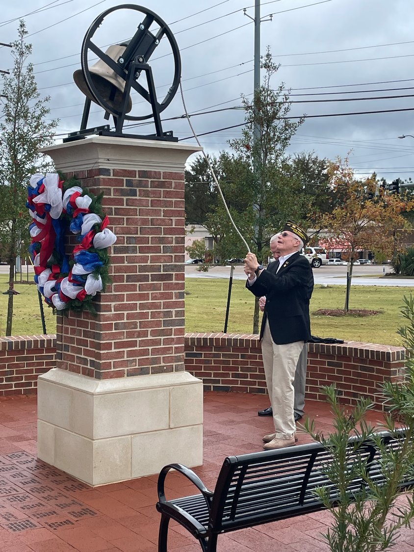 Ridgeland Alderman-at-Large and veteran D.I. Smith rings the bell at the Veterans Memory Park last Thursday.