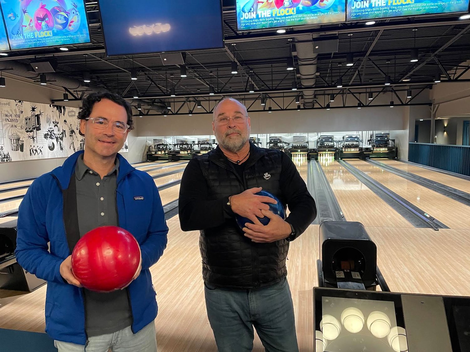 Developers David Pharr and Robert St. John get ready for a round at the new Highball Lanes in Fondren.