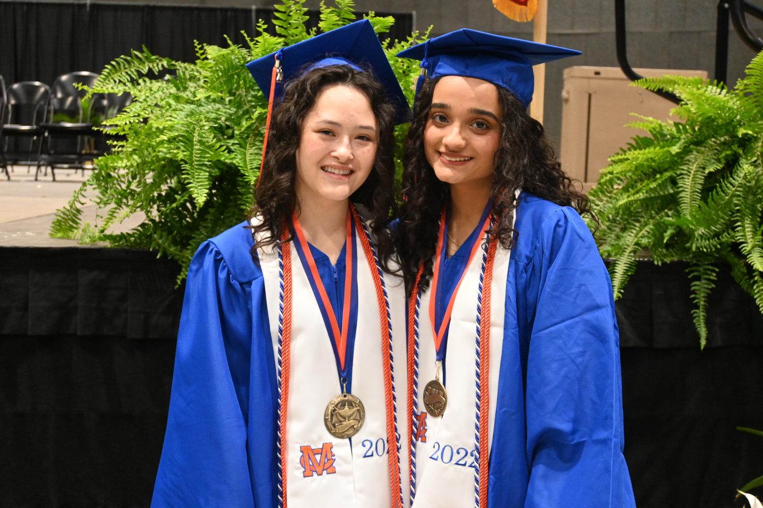 Madison Central High School Valedictorian (left) Sarah Grace Shurden, stand with Salutatorian Yumnaa Shaheen (right).