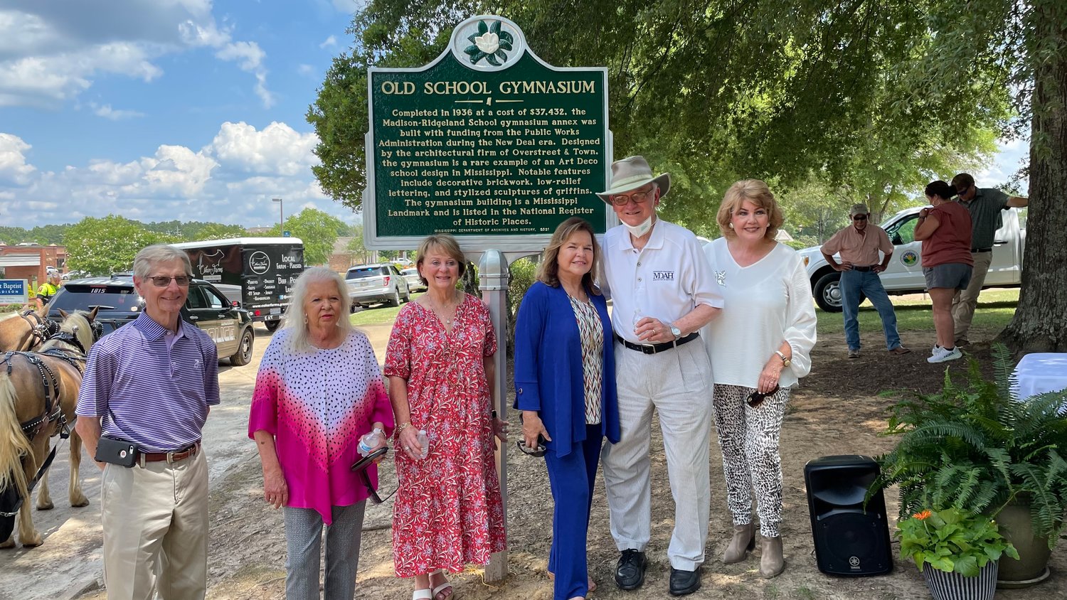City officials stand in front of the historic Old School Gymnasium sign, unveiled with State Department Director Emeritus Elbert Hillard on Tuesday afternoon. Pictured, from left: Alderman Guy Bowering, Alderman Tawanna Tatum, Alderman Janie Jarvis, Alderman Pat Peeler, Elbert Hillard, and Mayor Mary Hawkins-Butler.