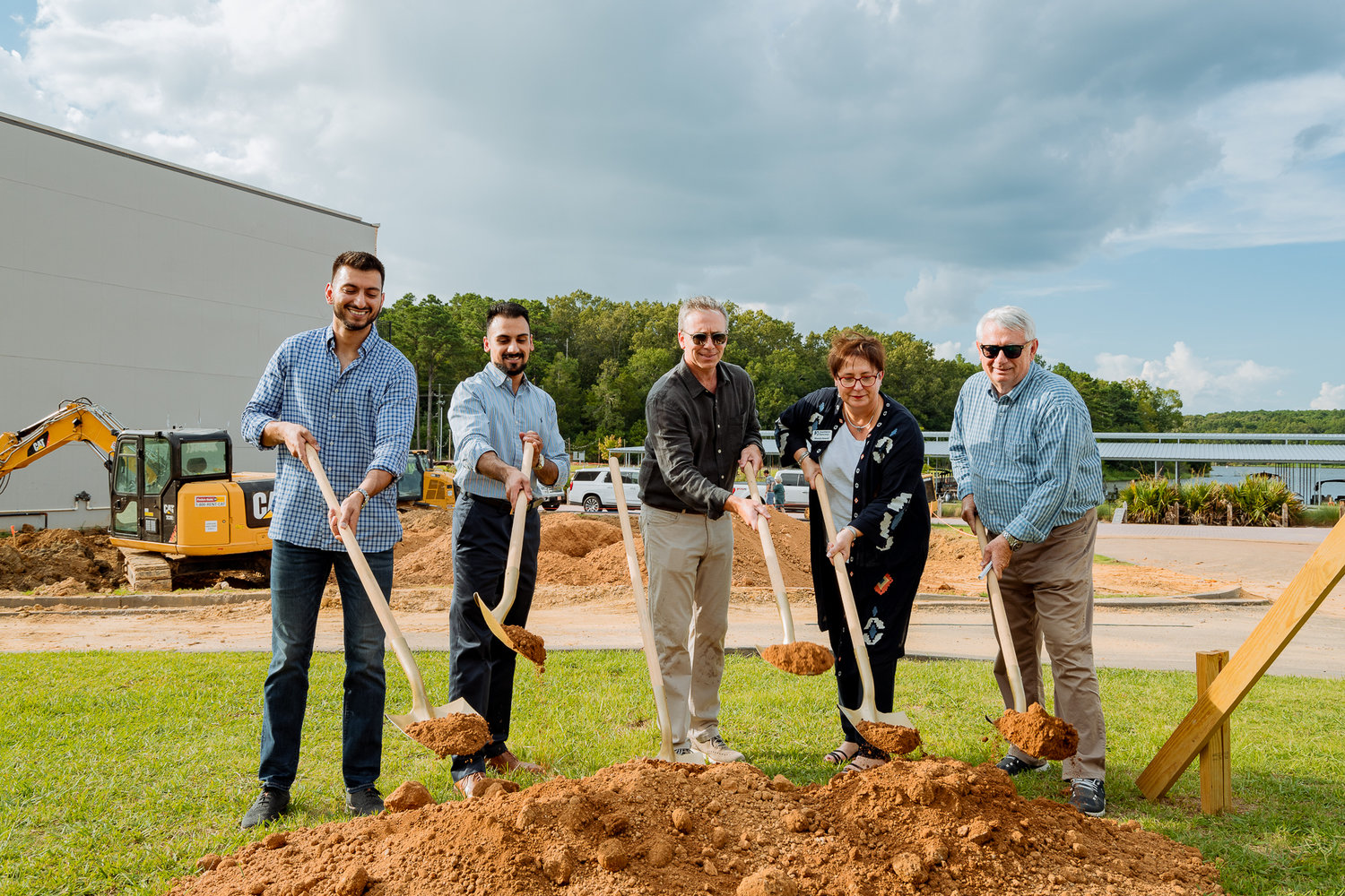 Members of the 145 Republic Street Condominiums project break ground to start construction on the new development at Lost Rabbit. Pictured, from left: Harmon Singh, RJ Singh, Todd Everett, Rhonda Newell, and Sam Everett.