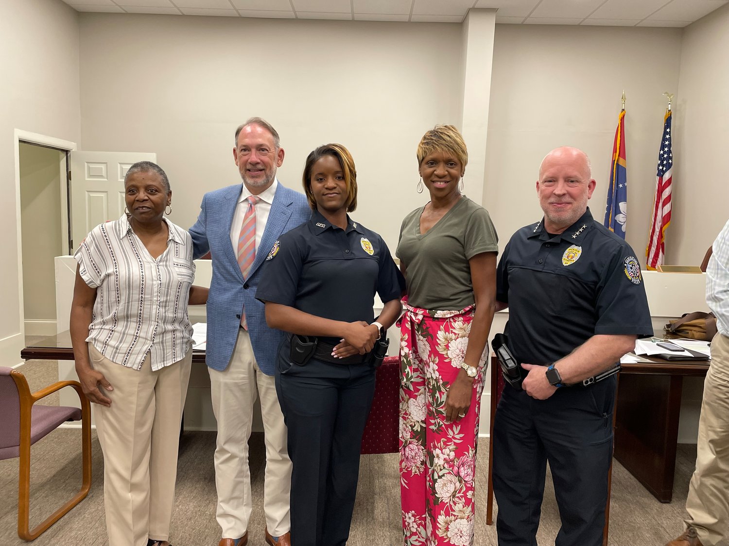 Sage Bowman, center, Gluckstadt’s first female police officer, stands with family and city officials. Pictured, from left: Sharon Johnson, Mayor Walter Morrison, officer Bowman, Sonya Bowman, and Police Chief Wendell Watts.