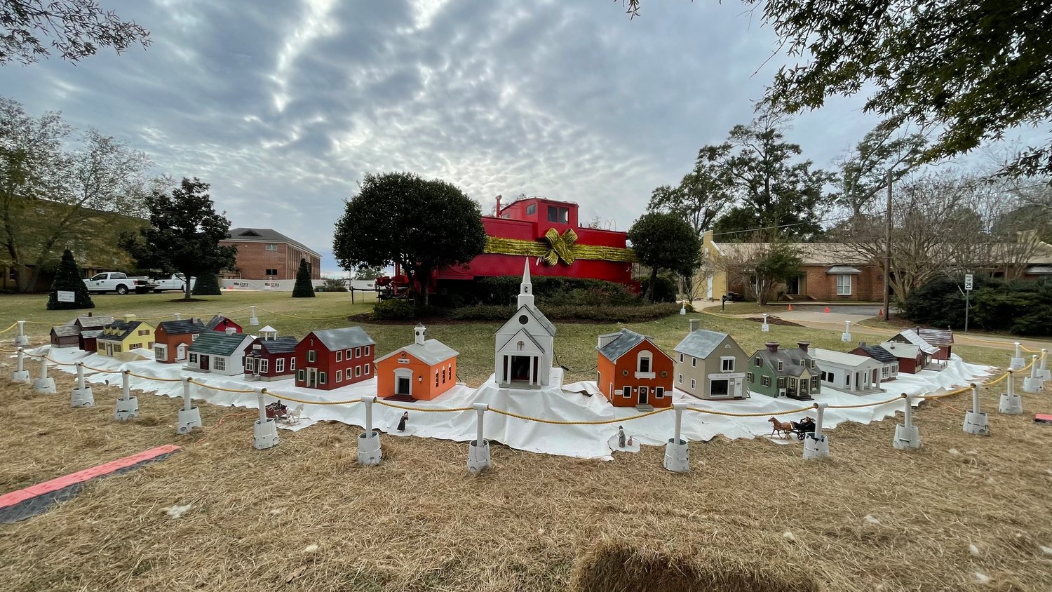 The Madison Christmas Village is on display in front of the Red Caboose on Main Street.